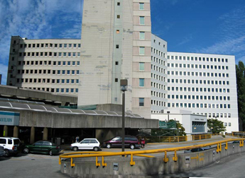 Again, the parking garage makes it impossible to reach the original spot on 1972’s open-air