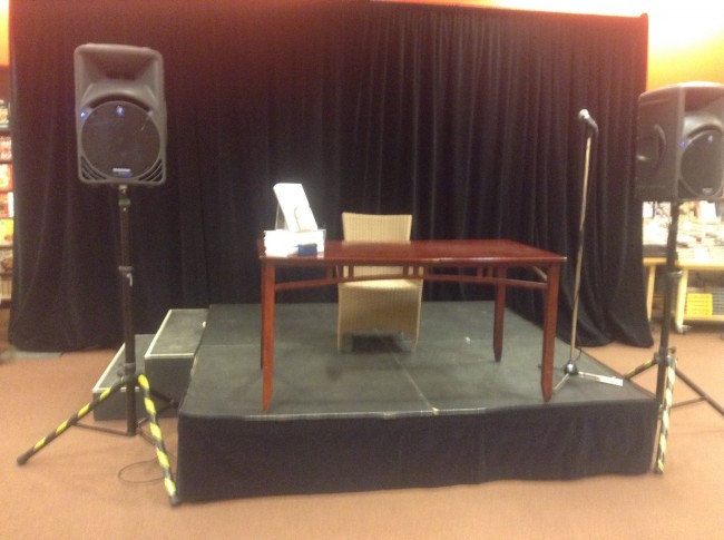 The stage and signing chair await the arrival of Mr. Cleese.